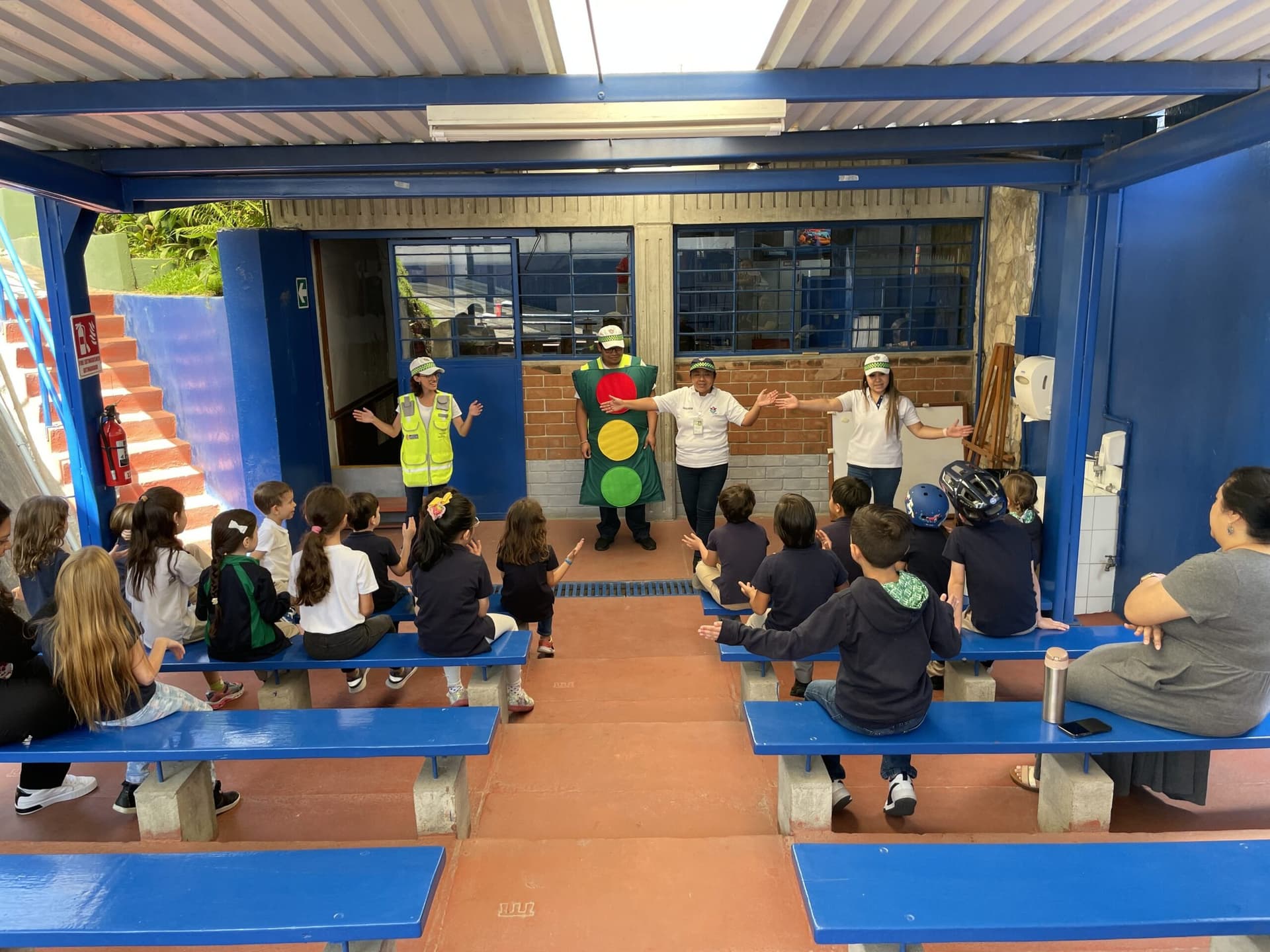 Students seated for an assembly on the covered court