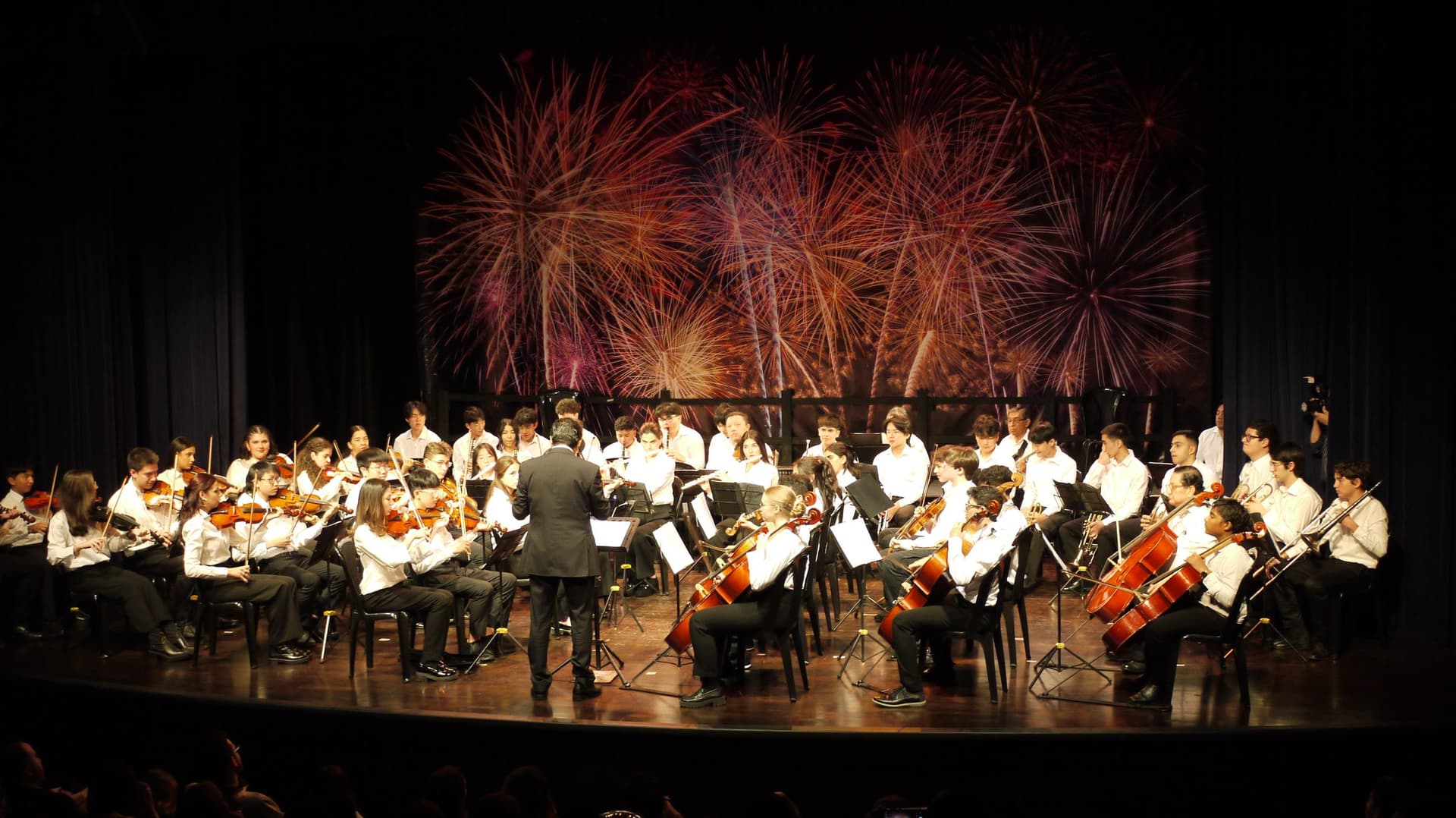 The Equity American School orchestra performing on stage