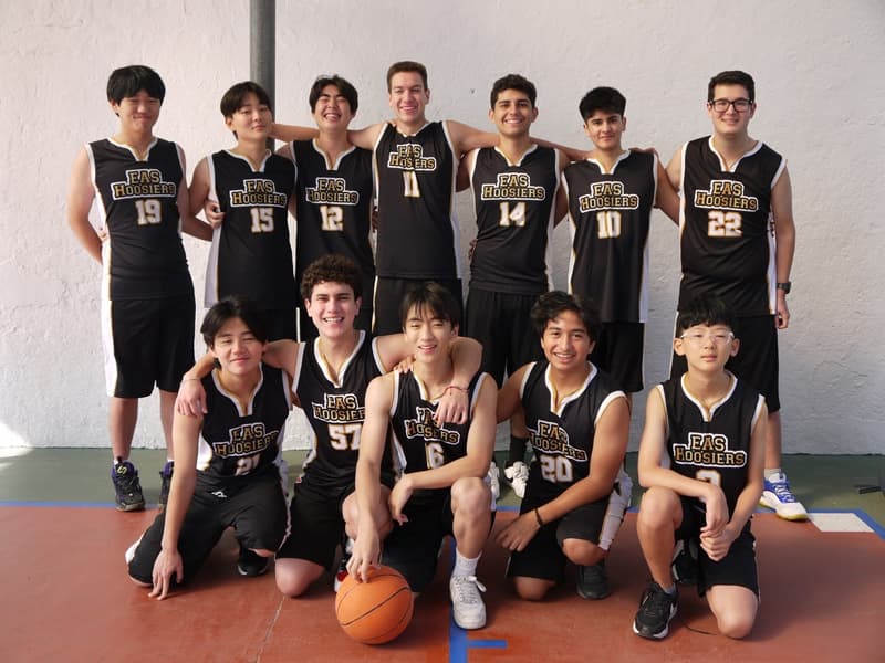 The Equity boys' basketball team in their EAS Hoosiers uniforms