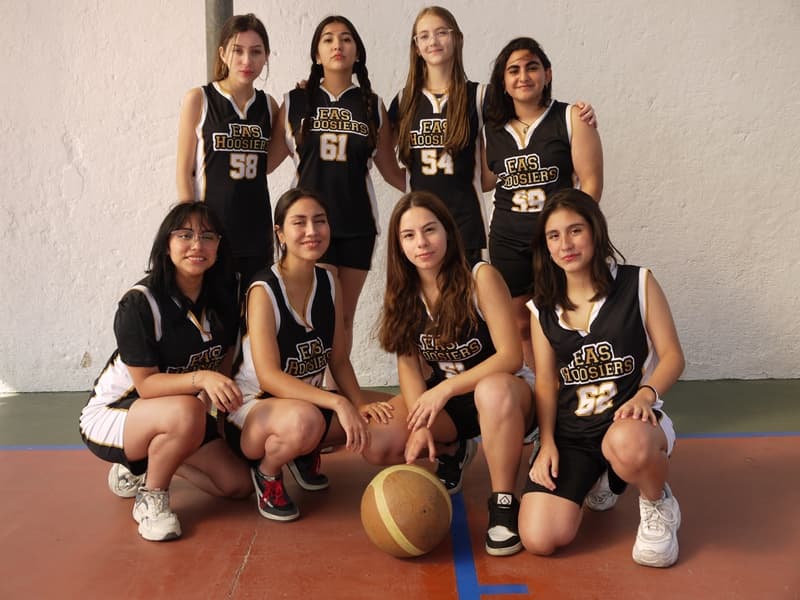 The Equity girls' basketball team in their EAS Hoosiers uniforms