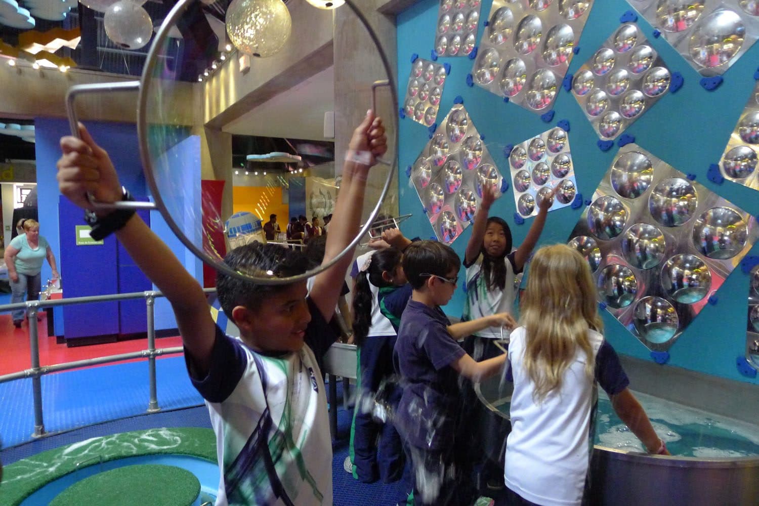 Students exploring an exhibit on a field trip